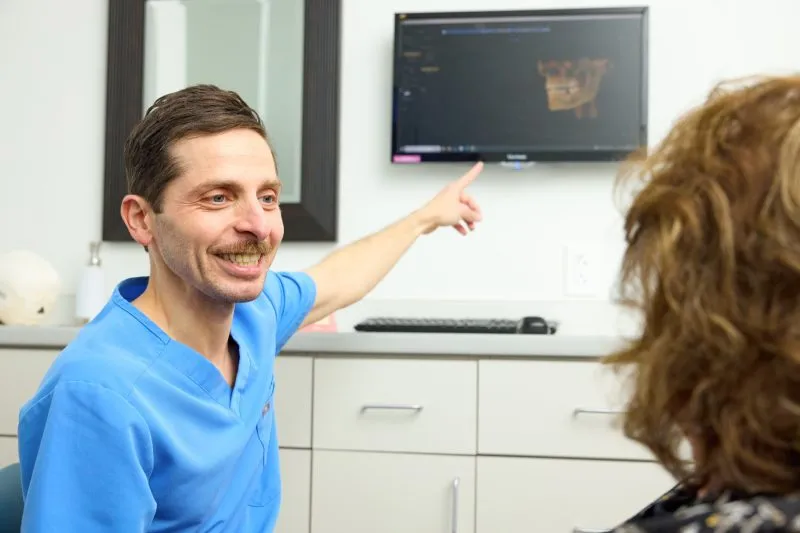 Dr. Ismail discussing details with a patient